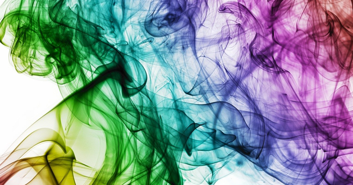 緑と紫の渦を描く抽象的な光の模様